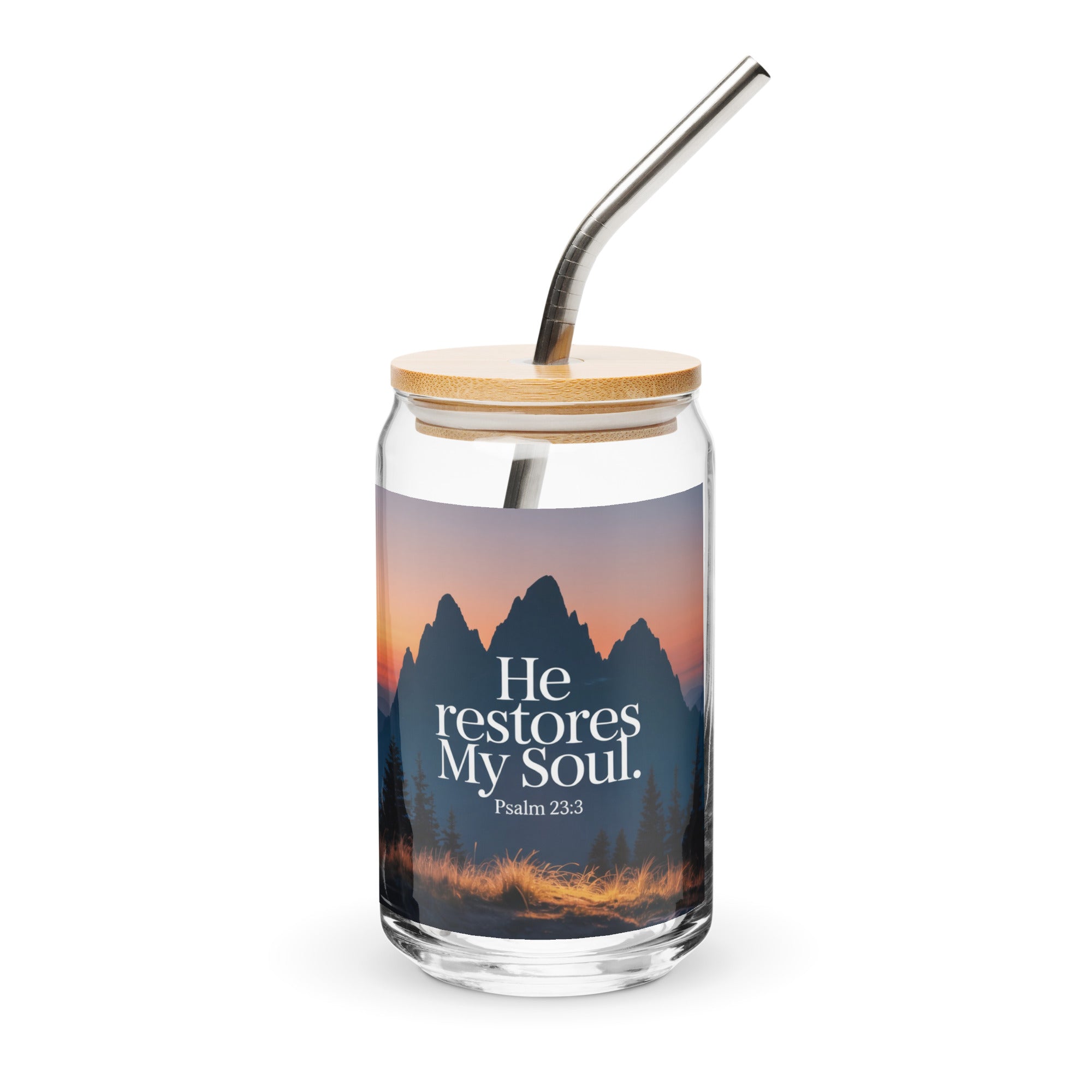 Glass tumbler with nature design and 'He restores My Soul' text on a white background
