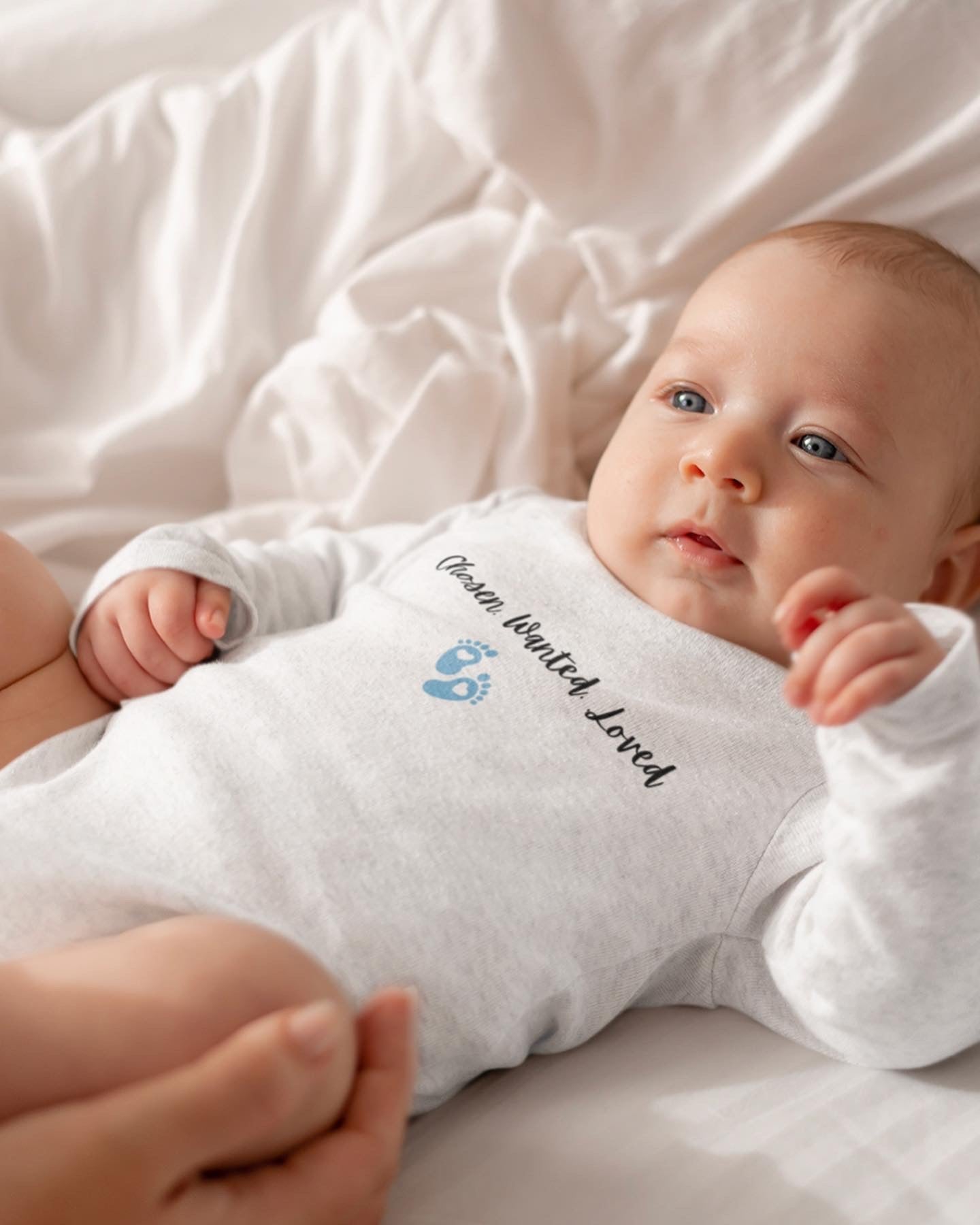 Wanted.Chosen.loved adoption onesie with baby boy footprints.