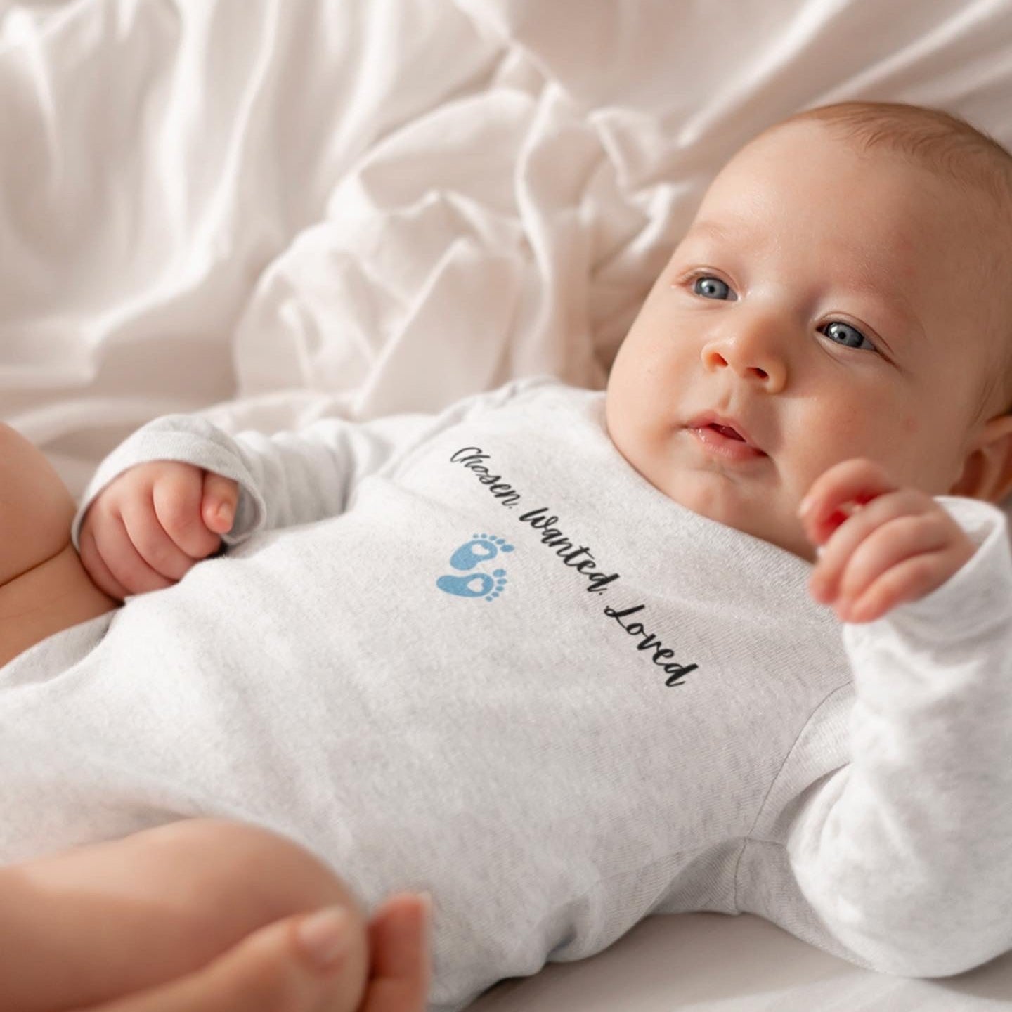 Wanted.Chosen.loved adoption onesie with baby boy footprints.